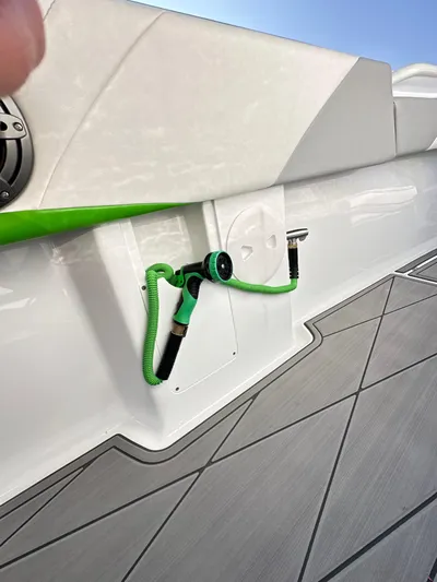  Yacht Photos Pics 2023 Statement 350 Open boat with green hose and sleek deck design.