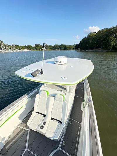  Yacht Photos Pics 2023 Statement 350 Open boat on calm water, featuring sleek design and advanced navigation equipment.