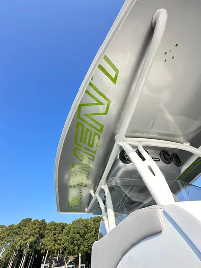  Yacht Photos Pics 2023 Statement 350 Open boat with sleek design and modern features against a clear blue sky.