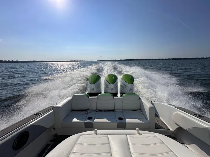  Yacht Photos Pics 2023 Statement 350 Open boat cruising on open water with triple engines.