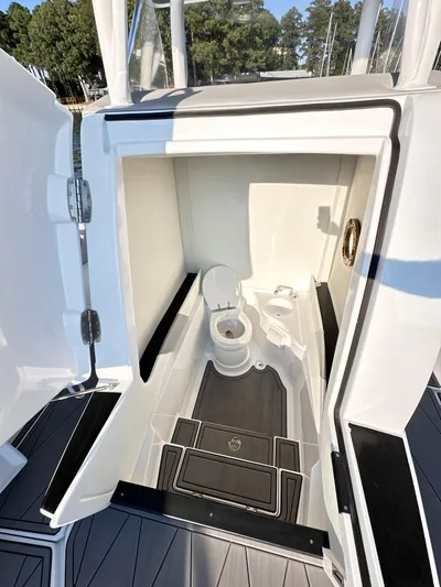  Yacht Photos Pics 2023 Statement 350 Open boat interior with compact bathroom and modern design.