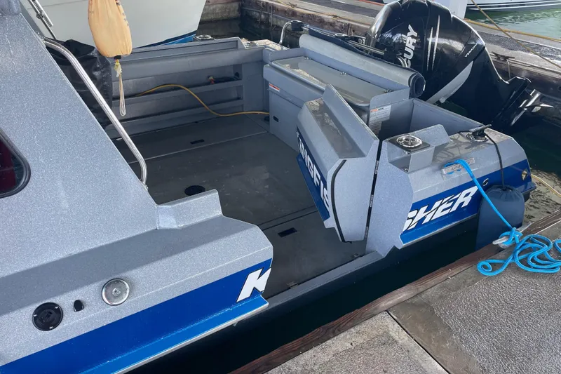  Yacht Photos Pics 2017 KingFisher 2825 Offshore boat docked, featuring spacious deck and Mercury outboard motor.