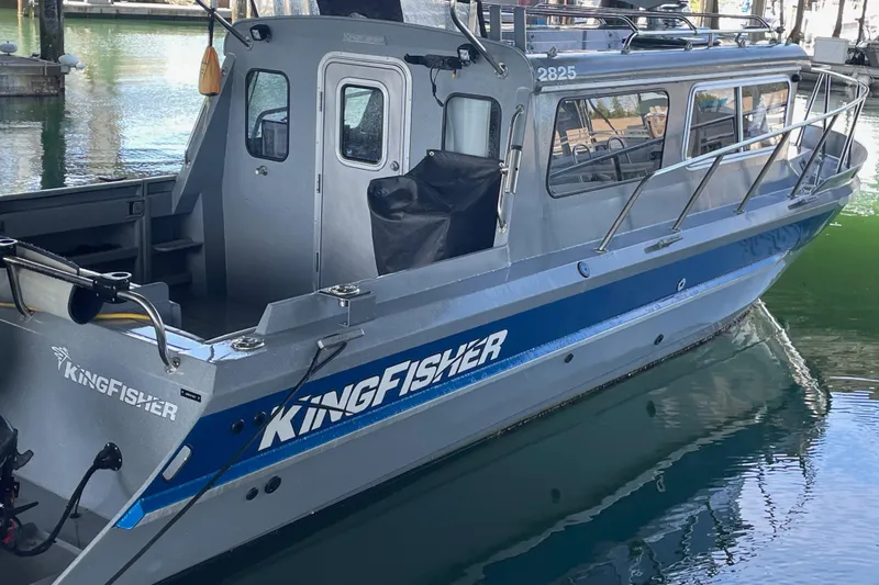  Yacht Photos Pics 2017 KingFisher 2825 Offshore boat docked in marina, side view.