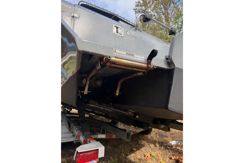  Yacht Photos Pics 2017 KingFisher 2825 Offshore boat underside showing exhaust pipes and trailer.