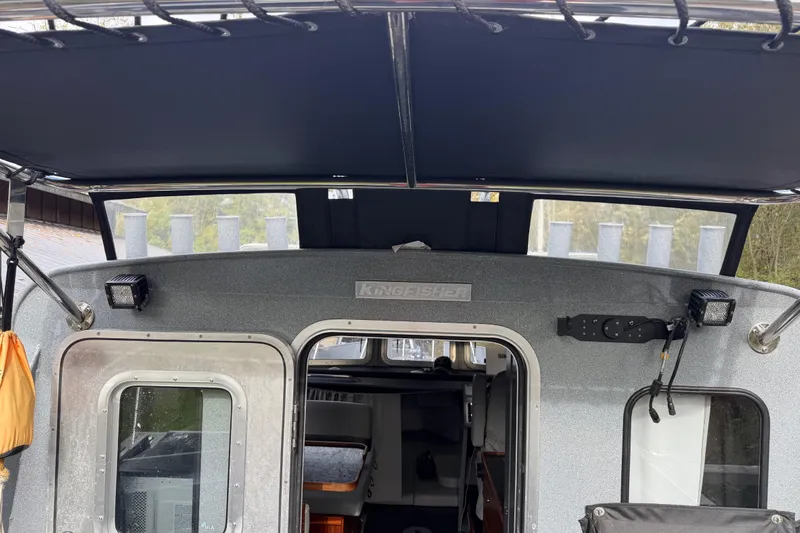  Yacht Photos Pics 2017 KingFisher 2825 Offshore boat interior with canopy and door view.