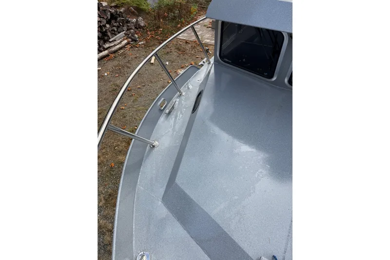  Yacht Photos Pics 2017 KingFisher 2825 Offshore boat deck with railing and windows.