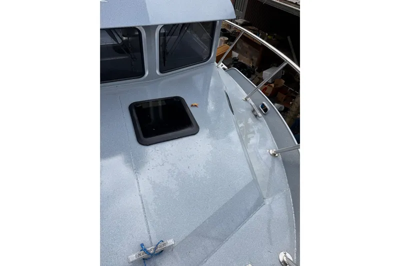  Yacht Photos Pics 2017 KingFisher 2825 Offshore boat deck with hatch and railing.