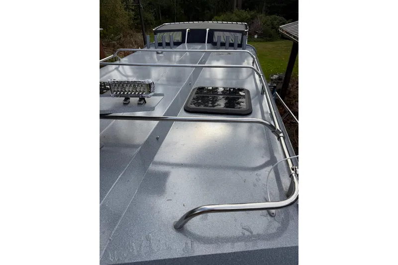  Yacht Photos Pics 2017 KingFisher 2825 Offshore boat deck with railing and hatch.
