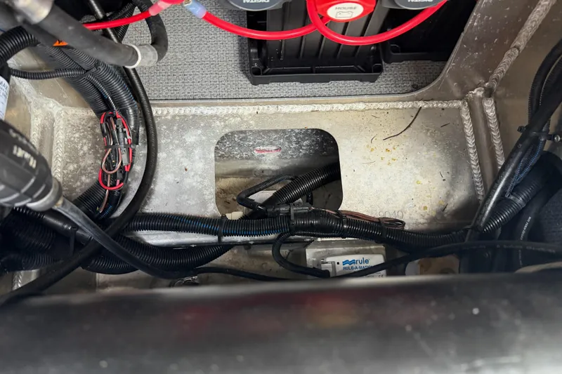  Yacht Photos Pics Engine compartment of a 2017 KingFisher 2825 Offshore boat, showing wiring and components.