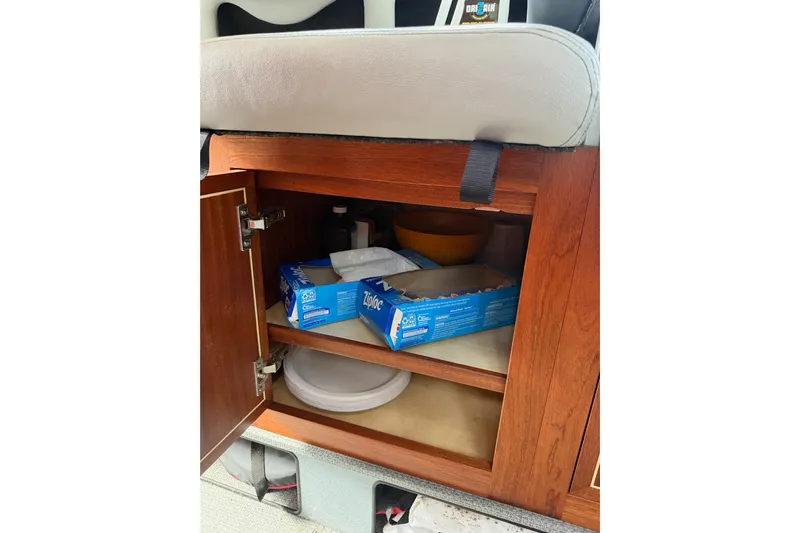  Yacht Photos Pics Cabinet storage inside 2017 KingFisher 2825 Offshore boat with Ziploc boxes and plates.