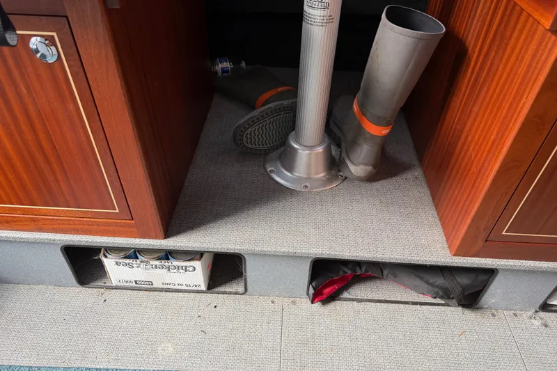  Yacht Photos Pics 2017 KingFisher 2825 Offshore interior with boots, storage, and wooden cabinetry.