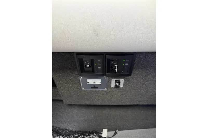  Yacht Photos Pics Control panel of a 2017 KingFisher 2825 Offshore boat, featuring switches and indicators.