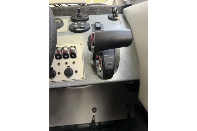 Yacht Photos Pics Control panel of a 2017 KingFisher 2825 Offshore boat with throttle and switches.