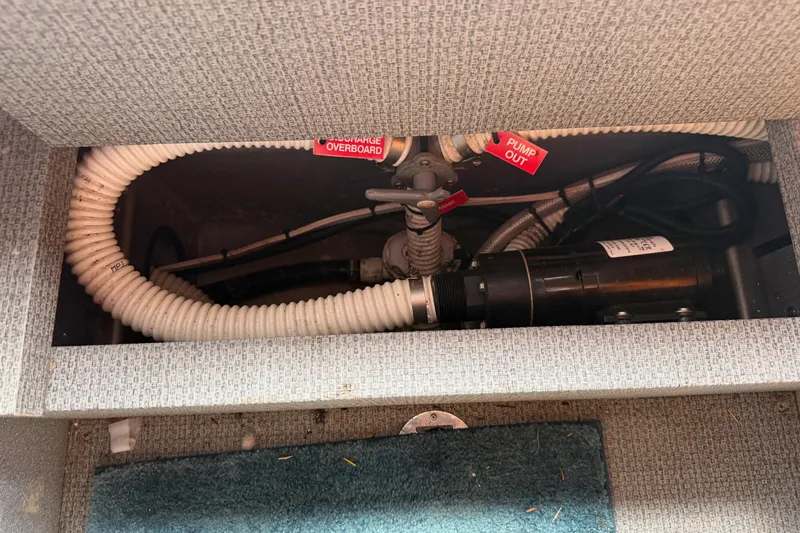  Yacht Photos Pics 2017 KingFisher 2825 Offshore boat plumbing system with hoses and pump components.