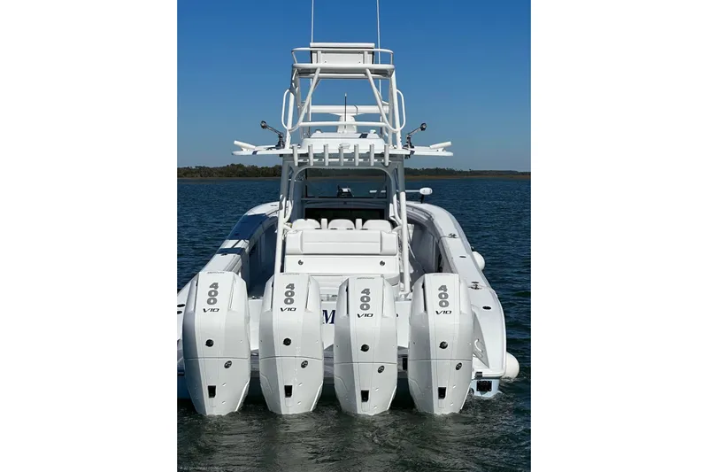 Fluid Mechanic Yacht Photos Pics 2024 Yellowfin 39 Offshore boat with four powerful outboard engines on the water.