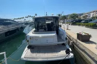 2019 Cranchi T36 Crossover yacht docked at a sunny marina.
