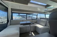 Interior of 2019 Cranchi T36 Crossover yacht with modern seating and panoramic windows.