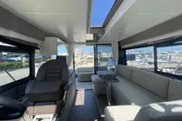 Interior of 2019 Cranchi T36 Crossover yacht, featuring modern seating and panoramic windows.
