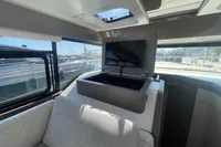 Interior of 2019 Cranchi T36 Crossover yacht with pop-up TV and modern design.