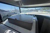 2019 Cranchi T36 Crossover interior with marina view through windows.