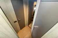 2019 Cranchi T36 Crossover interior hallway with modern wood paneling and doors.