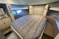 Luxurious cabin interior of 2019 Cranchi T36 Crossover with a cozy bed.