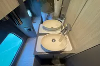 Modern bathroom interior of 2019 Cranchi T36 Crossover yacht with dual sinks.