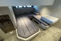 2019 Cranchi T36 Crossover cabin interior with modern bedding and control panel.