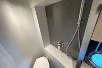 Bathroom interior of 2019 Cranchi T36 Crossover yacht, featuring modern shower and toilet.