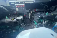 Engine room of 2019 Cranchi T36 Crossover with dual engines and control panel.