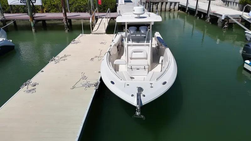  Yacht Photos Pics 2015 Sailfish 290cc boat docked at a marina, viewed from above.