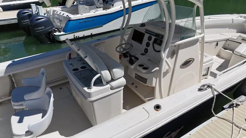  Yacht Photos Pics 2015 Sailfish 290cc boat interior with helm, seating, and controls.