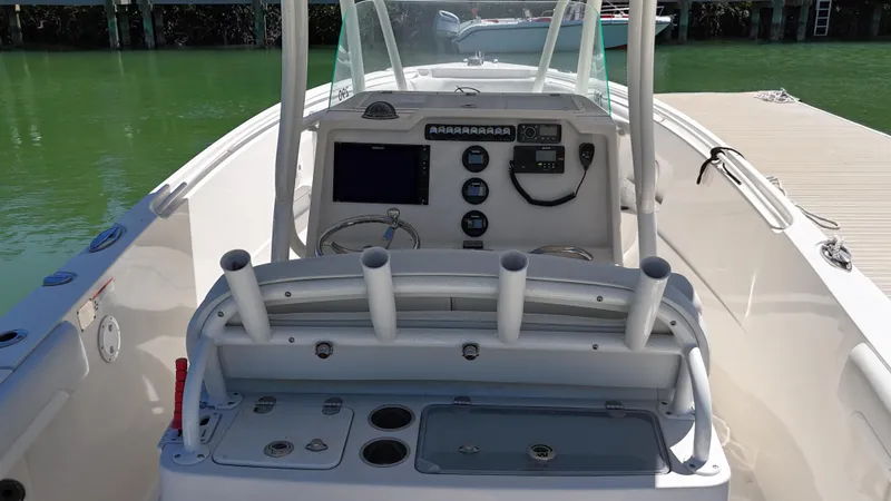  Yacht Photos Pics 2015 Sailfish 290cc boat cockpit with control panel and rod holders.