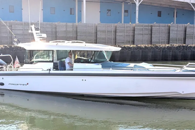 Nocellara De Belice Yacht Photos Pics 2024 Axopar 37 Cross Cabin with Bench Seat, V10s, docked in a marina.