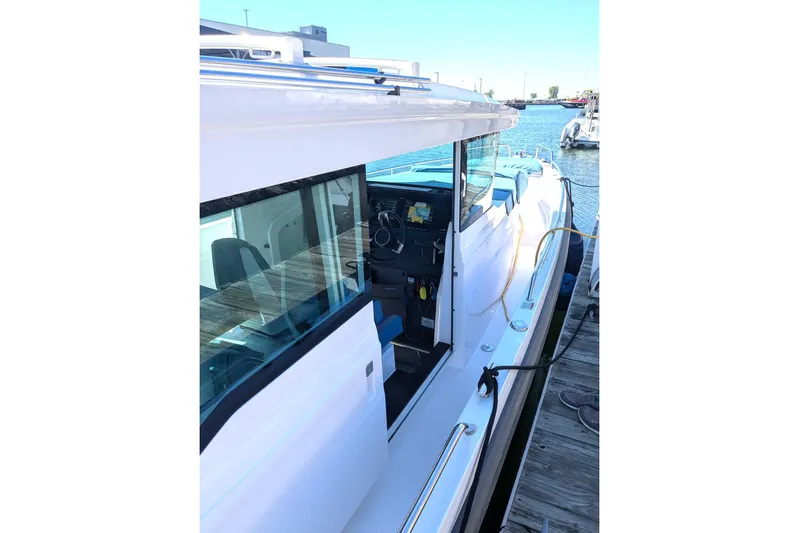 Nocellara De Belice Yacht Photos Pics 2024 Axopar 37 Cross Cabin with Bench Seat, docked, showcasing sleek design and modern features.