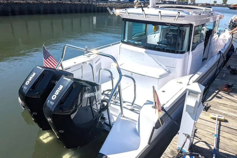 Nocellara De Belice Yacht Photos Pics 2024 Axopar 37 Cross Cabin with Bench Seat, V10 engines docked by the water.