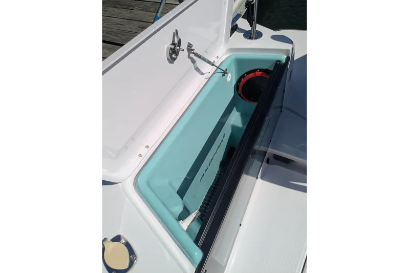 Nocellara De Belice Yacht Photos Pics Open storage compartment on 2024 Axopar 37 Cross Cabin boat with bench seat.