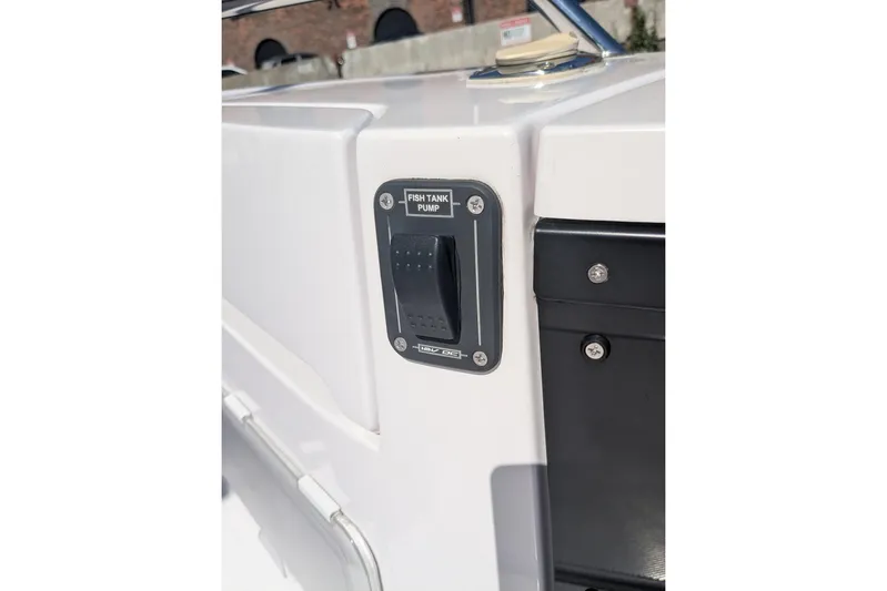 Nocellara De Belice Yacht Photos Pics 2024 Axopar 37 Cross Cabin fish tank pump switch on boat exterior.