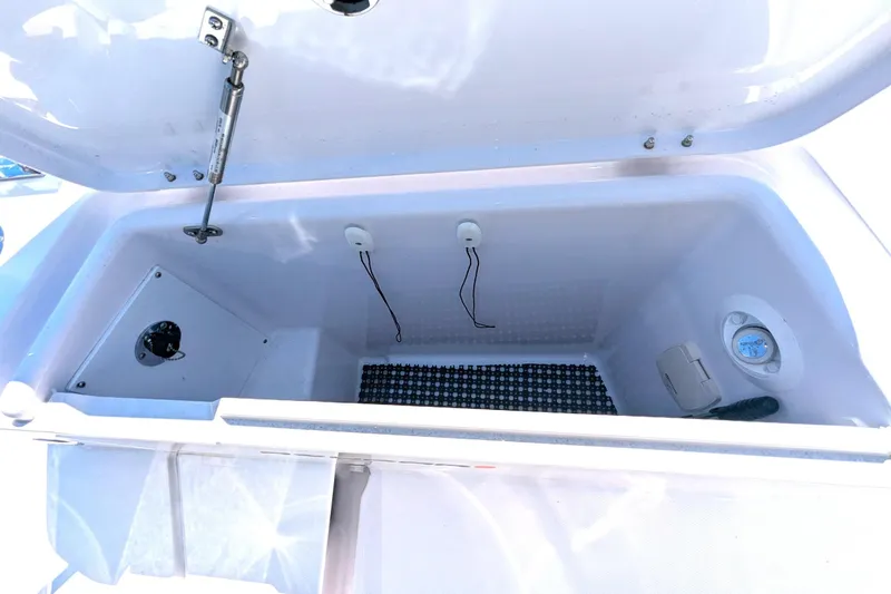 Nocellara De Belice Yacht Photos Pics Open storage compartment in 2024 Axopar 37 Cross Cabin with Bench Seat, V10s.