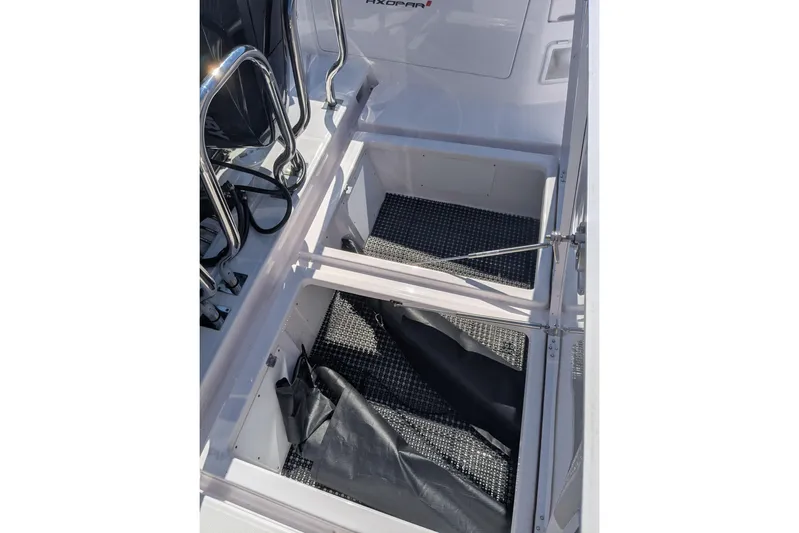 Nocellara De Belice Yacht Photos Pics 2024 Axopar 37 Cross Cabin storage compartment with bench seat and V10s.