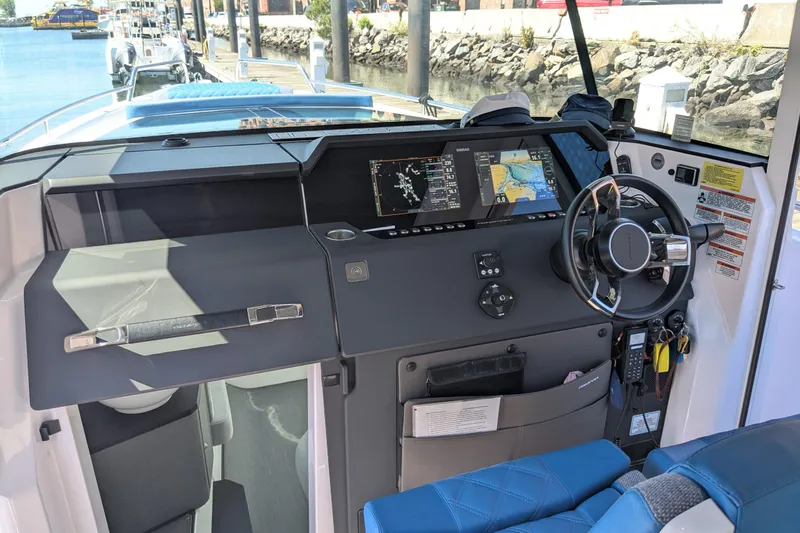 Nocellara De Belice Yacht Photos Pics 2024 Axopar 37 Cross Cabin helm with advanced navigation displays and controls.