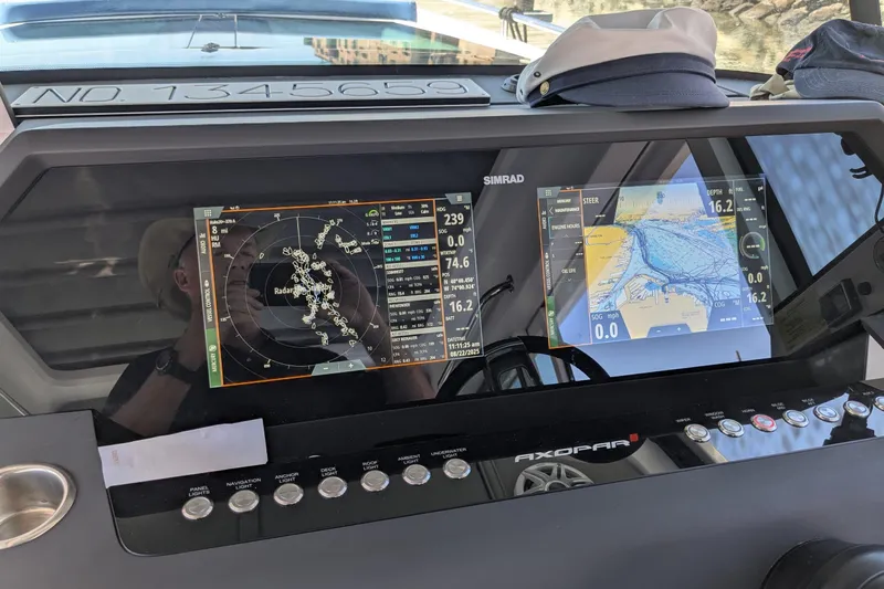 Nocellara De Belice Yacht Photos Pics 2024 Axopar 37 Cross Cabin dashboard with Simrad navigation displays and controls.
