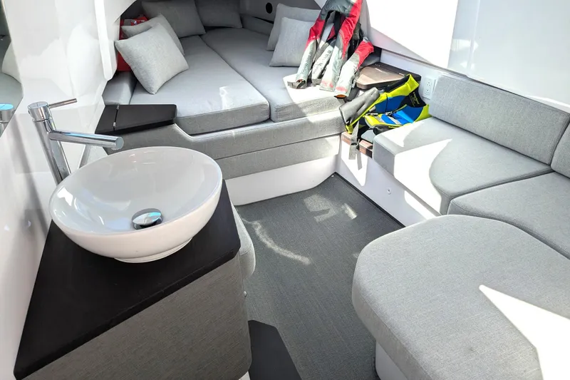 Nocellara De Belice Yacht Photos Pics 2024 Axopar 37 Cross Cabin interior with modern seating and sleek sink design.