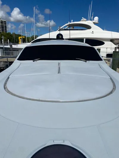  Yacht Photos Pics 2006 Pershing 50 yacht docked under clear blue sky.