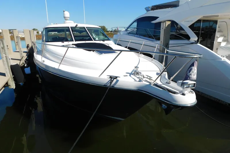  Yacht Photos Pics 2009 Tiara Yachts 4300 Sovran docked at marina, sleek design, sunny day.