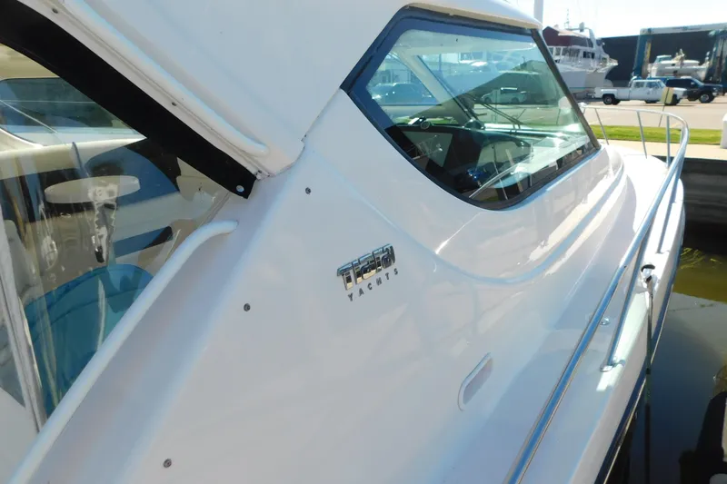  Yacht Photos Pics 2009 Tiara Yachts 4300 Sovran, sleek white exterior with logo, docked in marina.