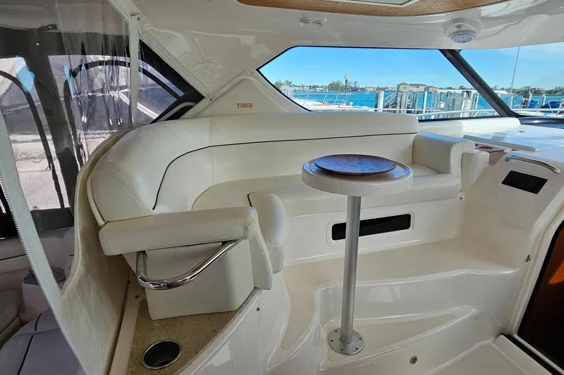  Yacht Photos Pics Luxurious interior of 2009 Tiara Yachts 4300 Sovran with elegant seating and table.