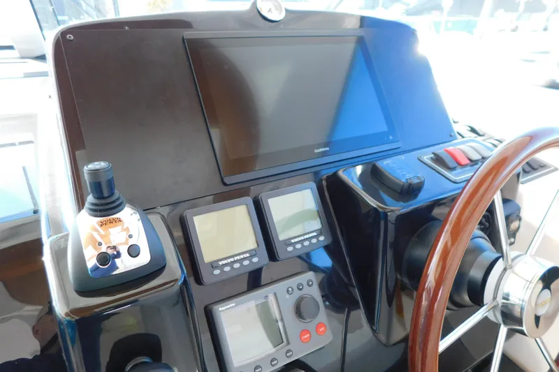  Yacht Photos Pics 2009 Tiara Yachts 4300 Sovran helm with Garmin display and Volvo Penta controls.