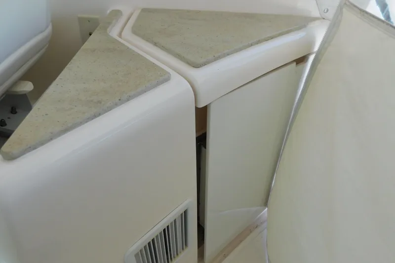  Yacht Photos Pics Interior detail of 2009 Tiara Yachts 4300 Sovran, featuring a corner cabinet with beige countertop.