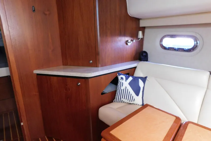  Yacht Photos Pics 2009 Tiara Yachts 4300 Sovran interior with wood cabinetry and white seating.